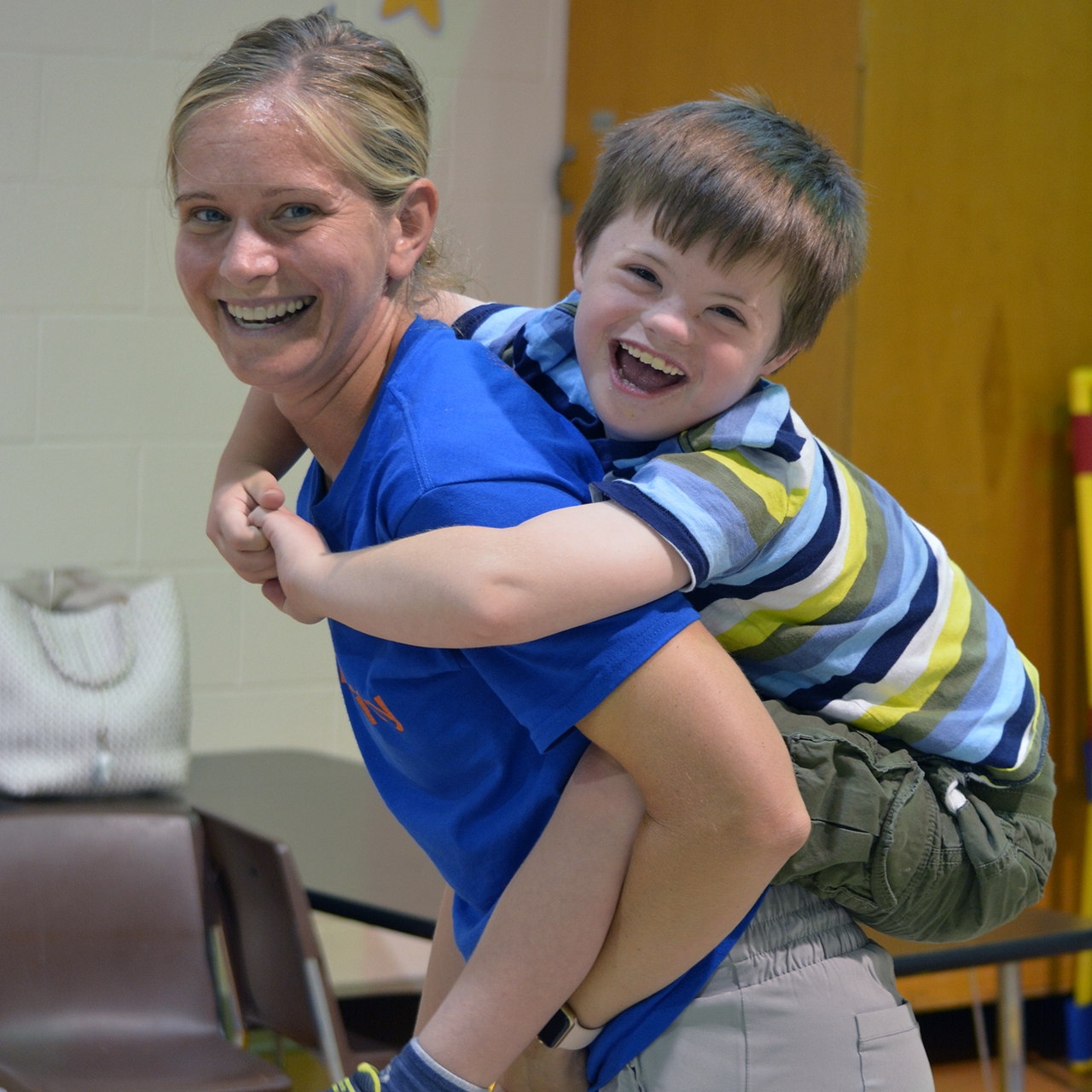 ESC staff member playing with a child