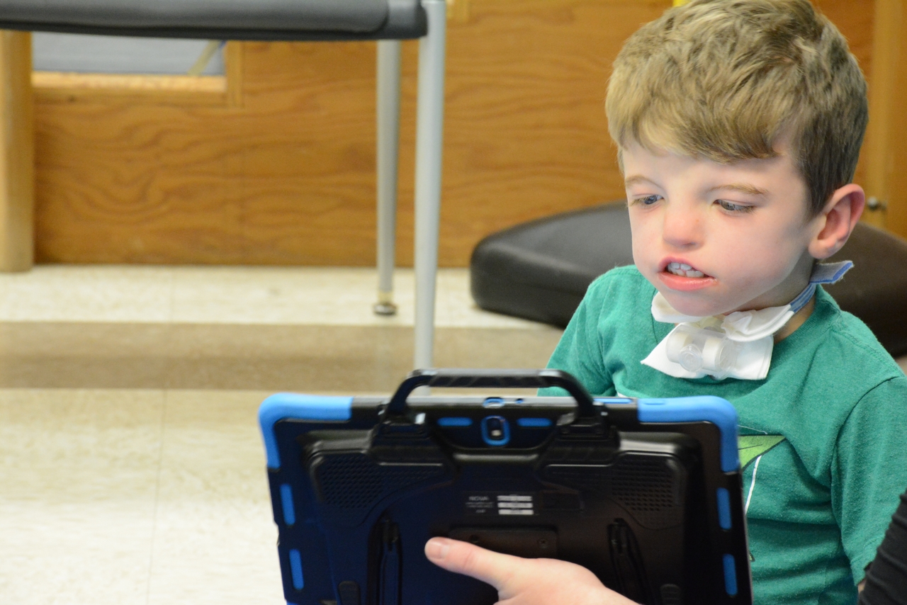 Childrens Therapy or Aug com Boy on a tablet