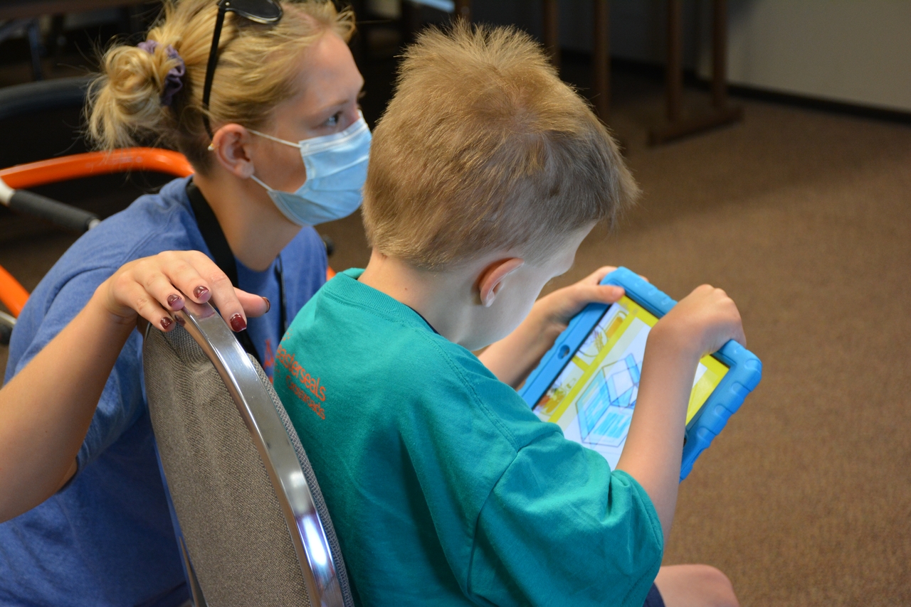 Childrens Therapy or camp ESC employee, working with a child