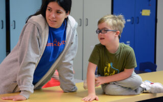 boy and camp counselor