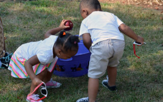 two kids playing with water