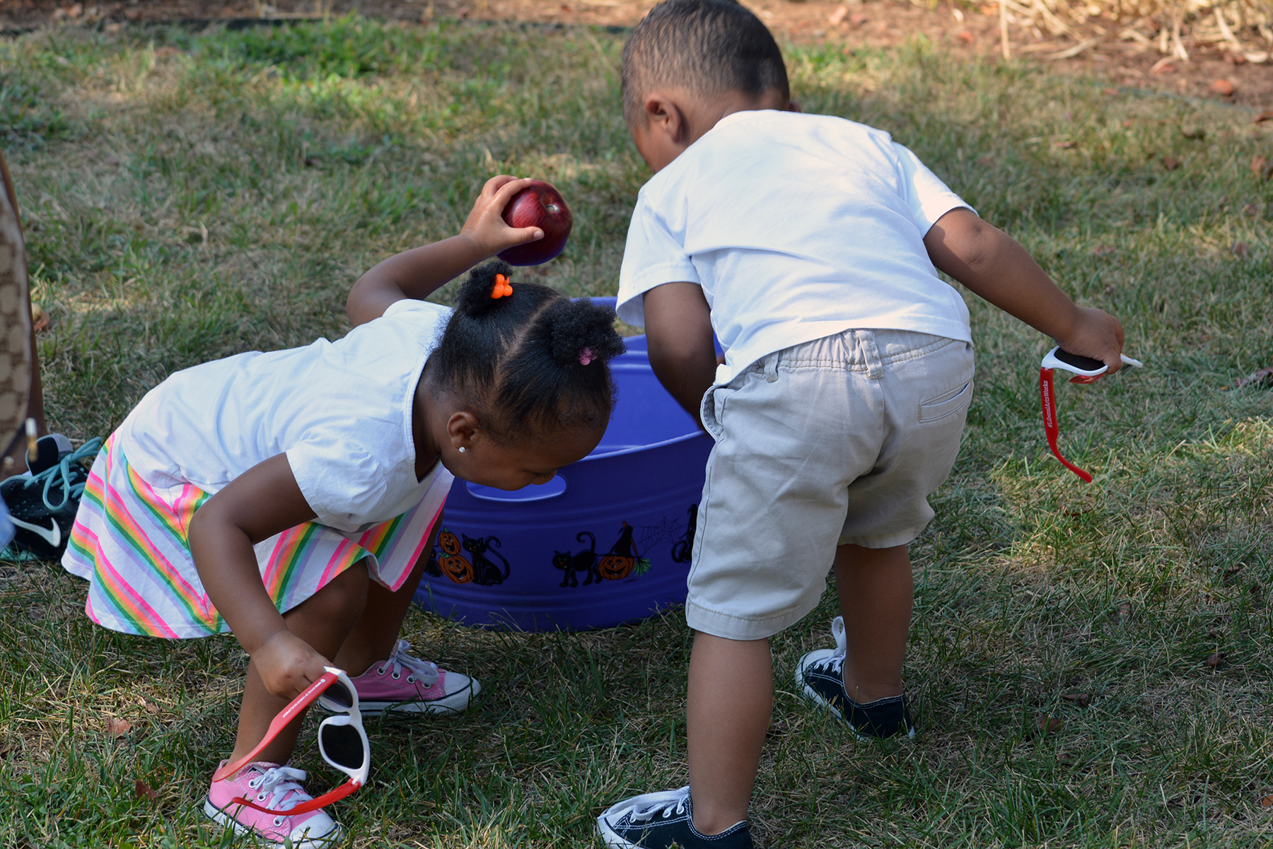 two kids playing with water