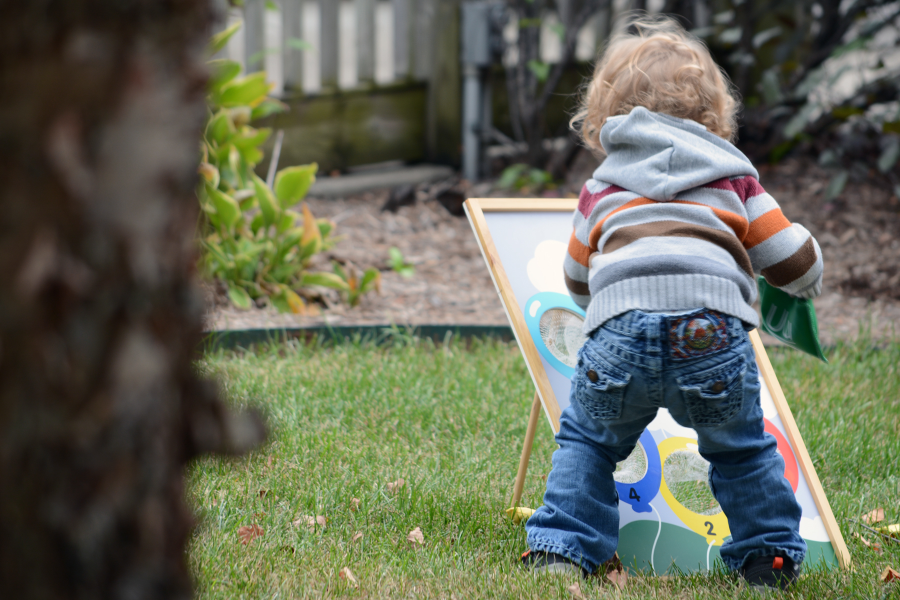 small child playing in garden