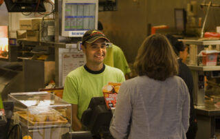employee and customer at pet food store