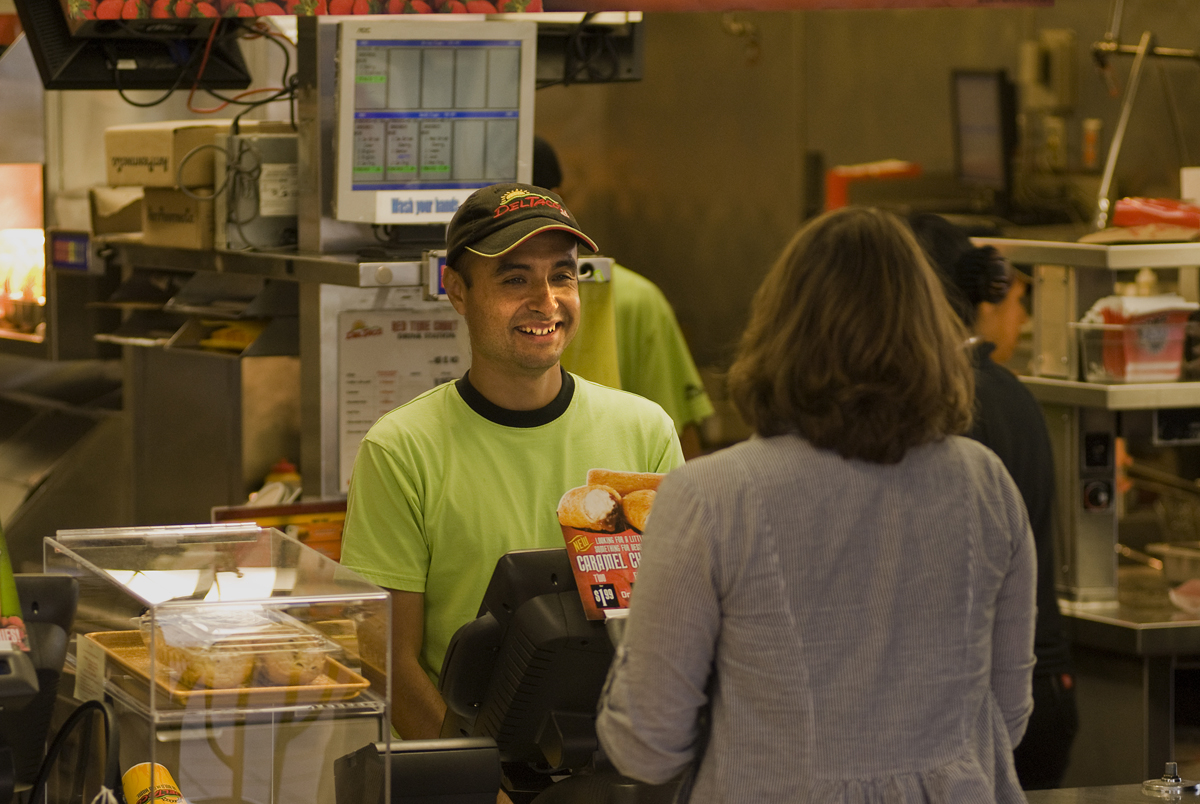 employee and customer at pet food store