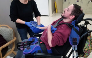 recreational therapist building strength with person