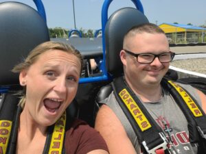 Gina and Tyler having fun on a roller coaster