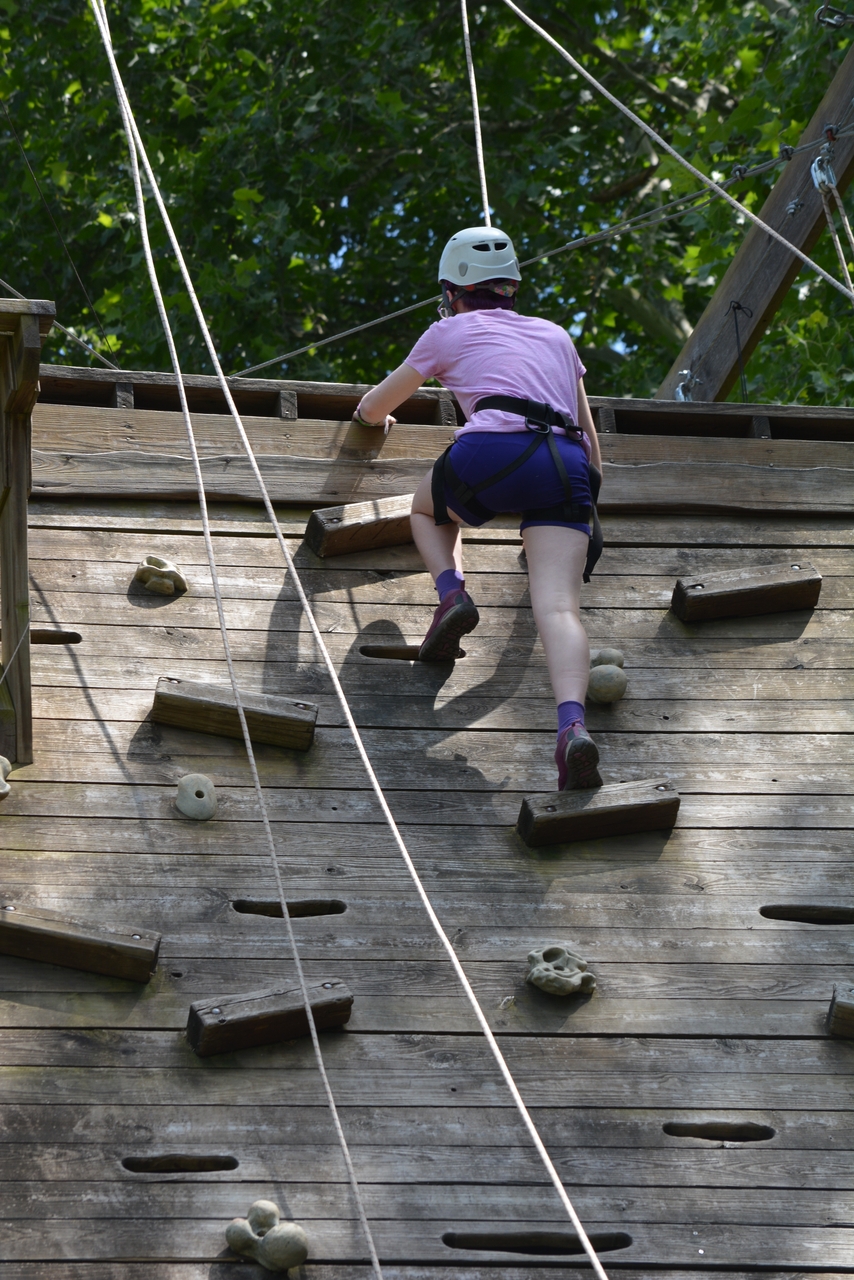 a child climbing on a climbing wall