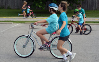 ican bike riders with spotters riding