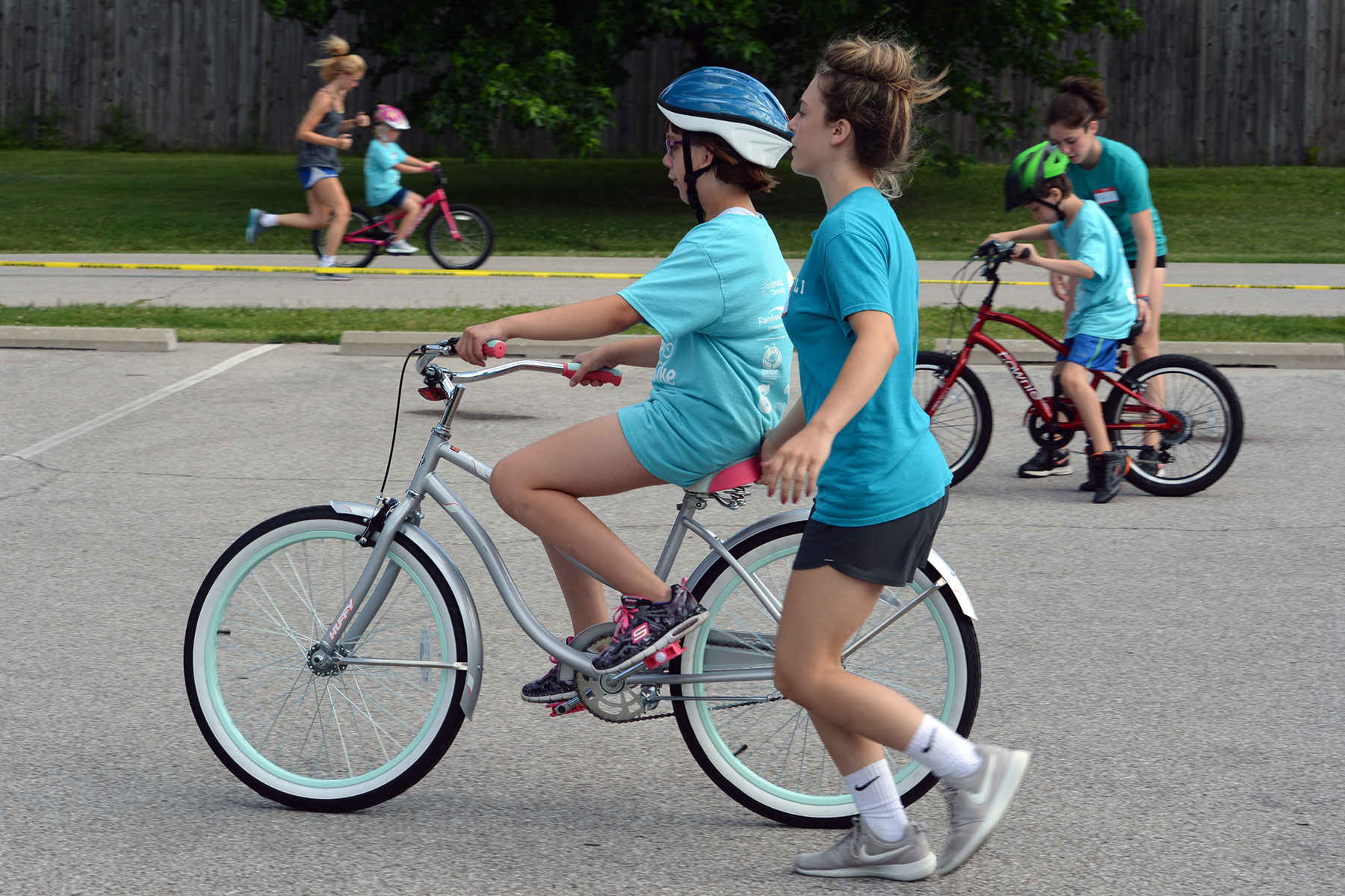 ican bike riders with spotters riding