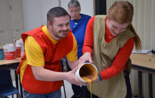 Adult Day staff and participant creating art