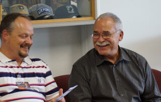 image of two male veterans talking